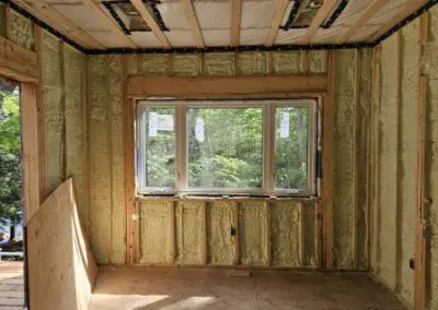 New spray foam insulation around large window